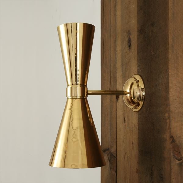 With an eye-catching design, the Amias elegant wall light is a pure 60's stilnovo design. Suitable for contemporary settings, this sophisticated spun cone wall light will light up the darkest of rooms with sophistication.