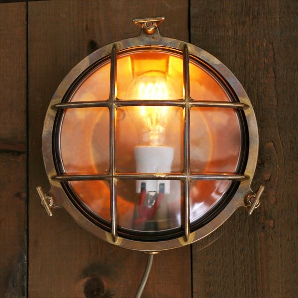 The Adoo marine nautical wall light from Mullan Lighting has a unique, industrial-style design that will create a warm, inviting glow for diners in a restaurant space. 