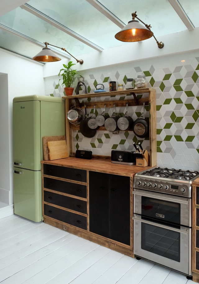 ReliCreations used industrial lighting fixtures from Mullan Lighting to enhance the industrial charm of this kitchen space. 