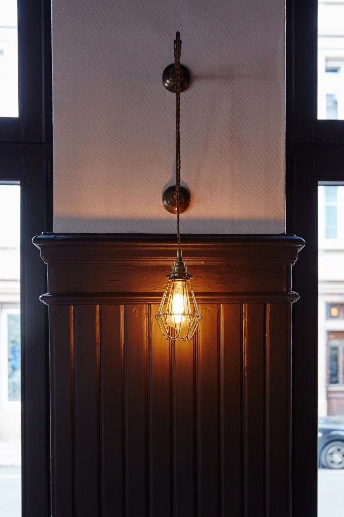 Old world charm at Les Innocents with the Apoch industrial wall light from Mullan Lighting