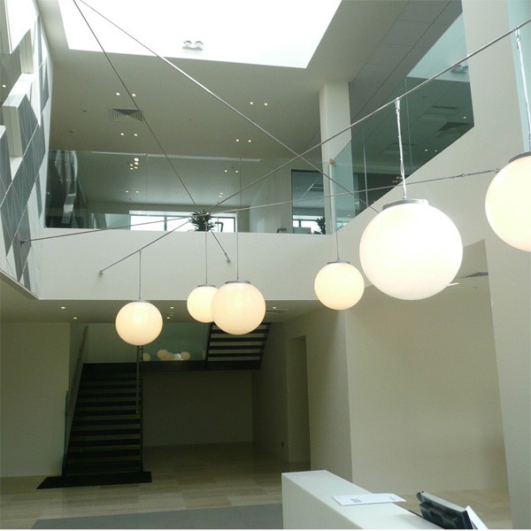 Bespoke opal globe pendants created by Mullan Lighting