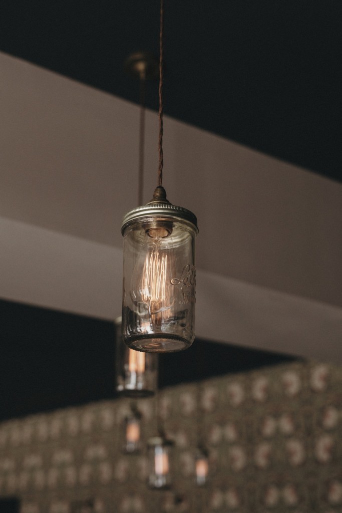 Suspended from a simple decorative cable, the Jam Jar pendants from Mullan Lighting feature an exposed filament bulb. 