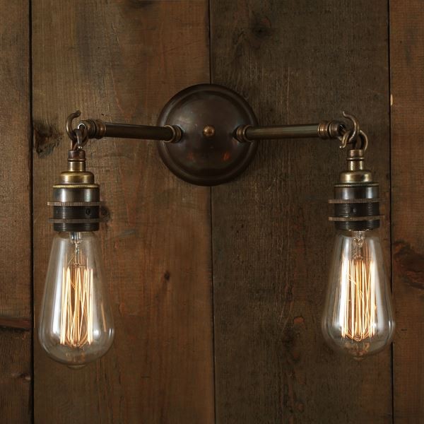 With an industrial flair, the Arrigo double wall light brings the light exactly where you want it in two distinct locations.