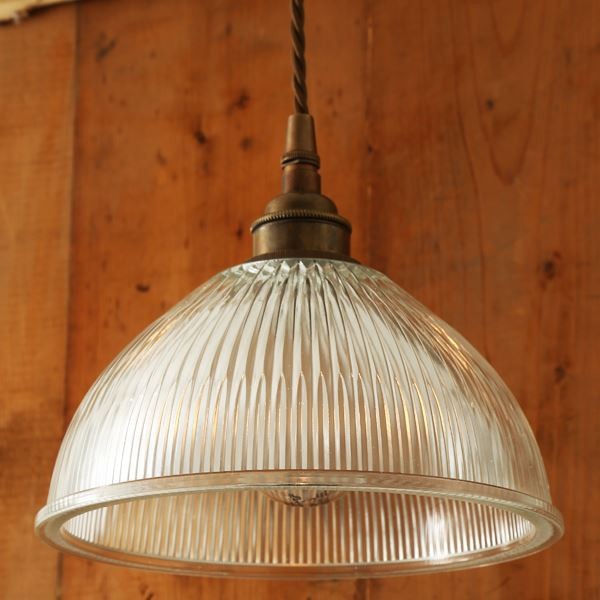 Clean and sleek with an industrial edge, the Boston industrial Holophane pendant is a modern update on a classic light. This holophane pendant light will command attention over a kitchen island, dining table, or antique pool table.