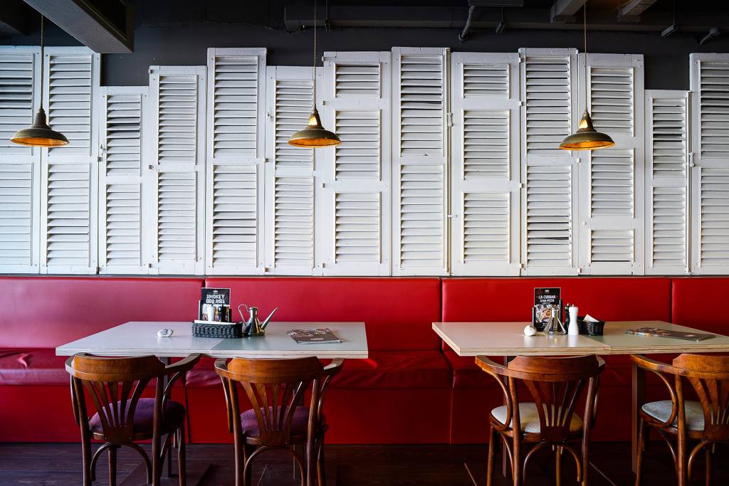 Our Geneva industrial brass pendant creates a more intimate dining experience.