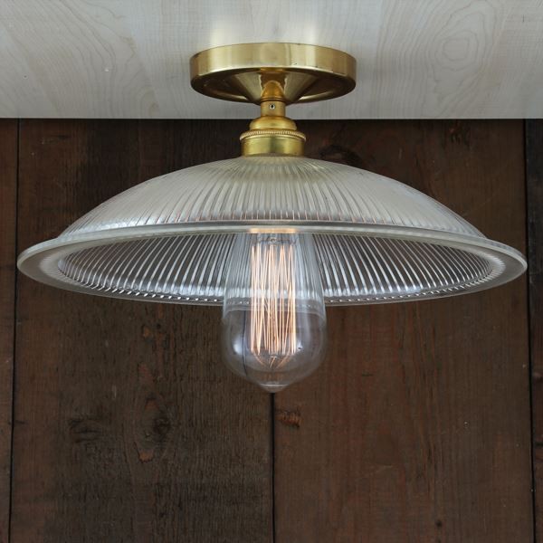Elegant and sophisticated, the Calix Holophane flush ceiling light has a modern flair and is easy to coordinate with your decor. This flush ceiling light looks splendid mounted in a hallway or over a kitchen table.
