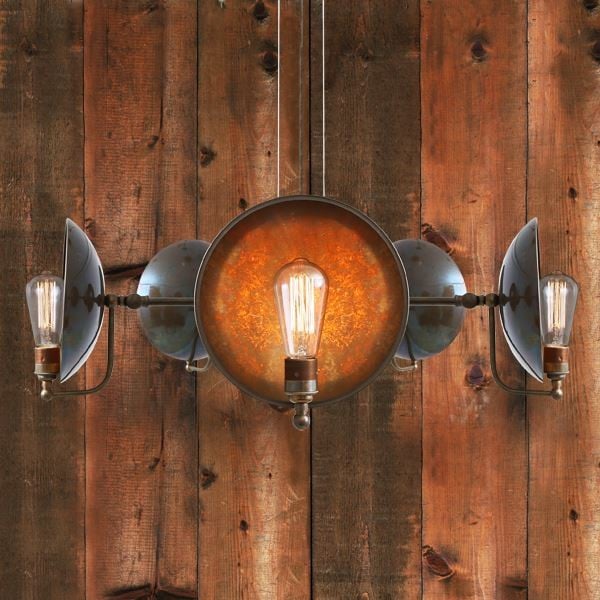 Cullen B five-arm chandelier is a multi-arm version of one of our most popular wall lights the Cullen wall light. Emanating warmth through its shadowed back plate, this industrial chandelier embodies the richness of the brass work.