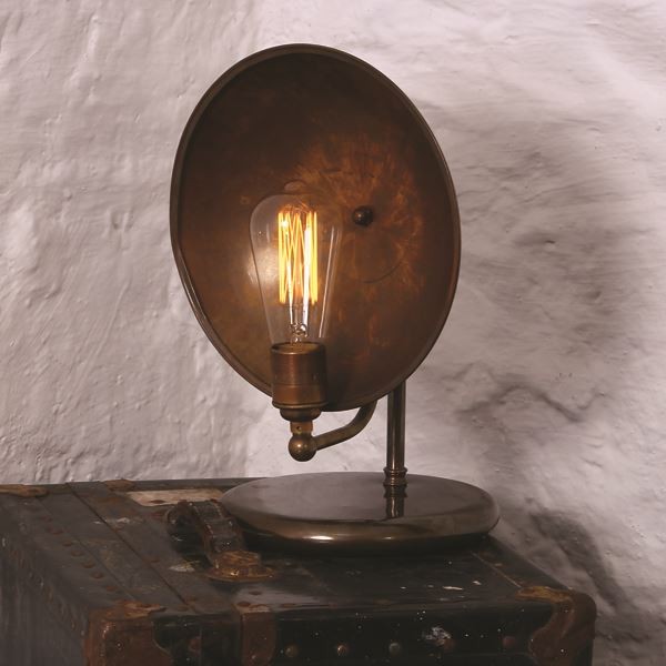 Bring some texture to your home with the Cullen table lamp. This charming, old-world inspired lamp features a vertical back plate shade constructed of patina with vintage industrial finish to provide it an incomparable look.