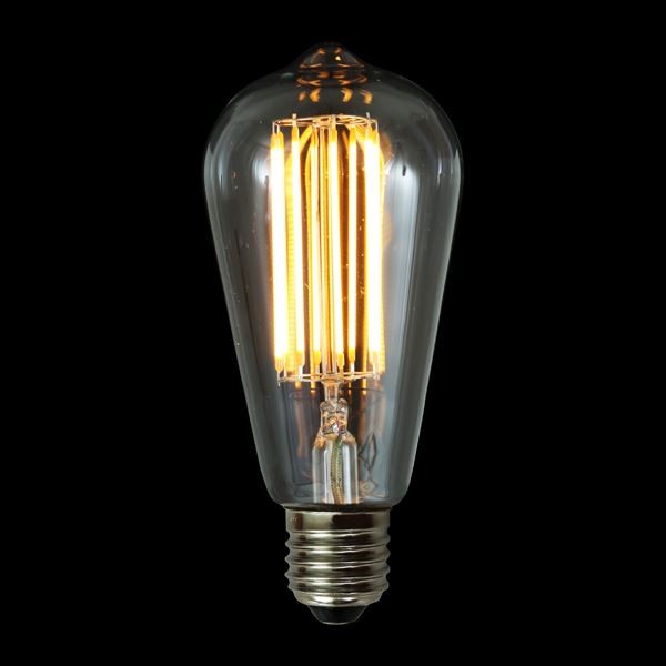 The E27 2W LED teardrop bulb has a warm hue that creates a vibrant glow reminiscent of early 20th-century lighting.