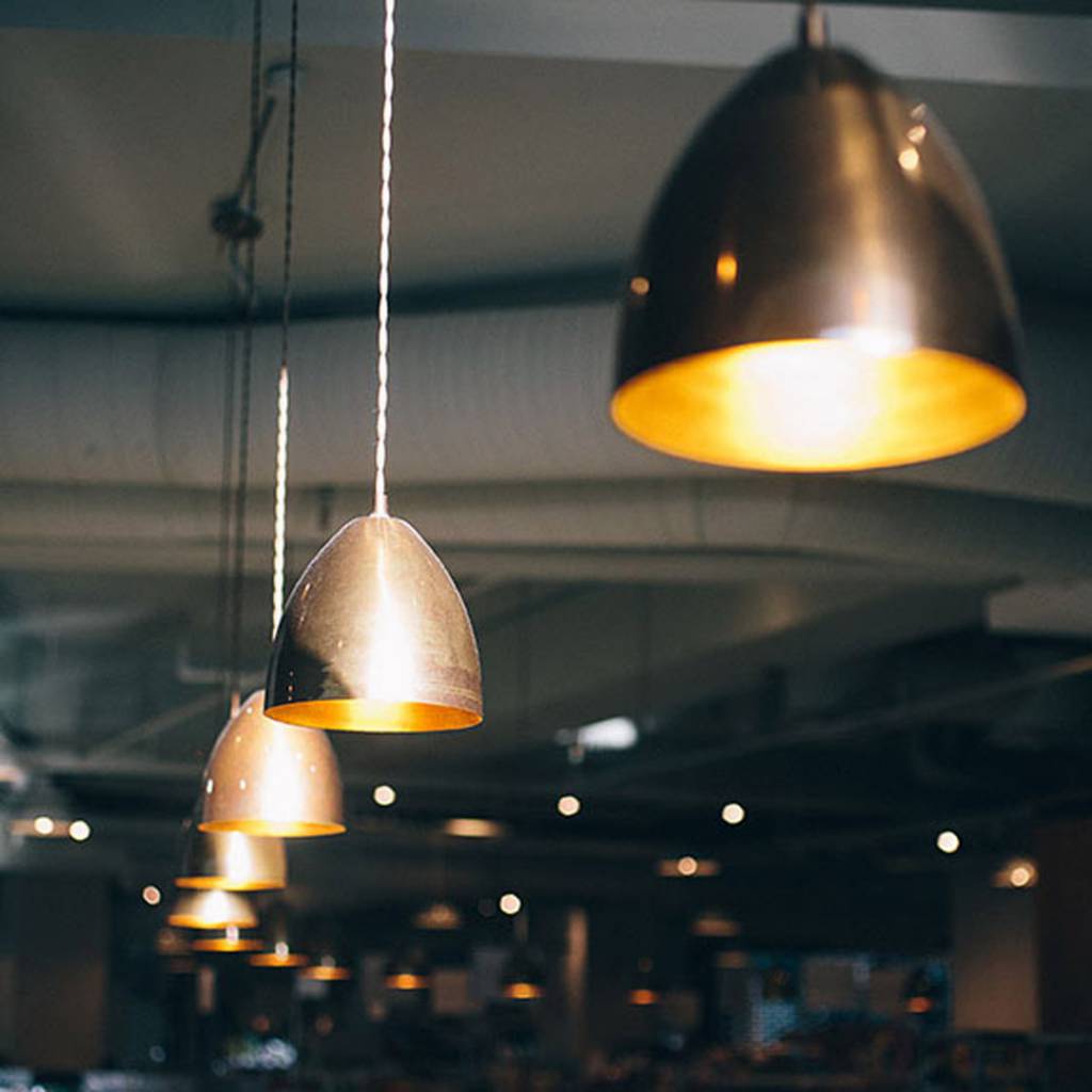 Our Skyler cone pendants add to the retro-style surroundings 