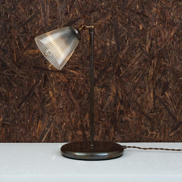 Inspired by classic industrial design, the Gadar table lamp offers an eye-catching profile and appearance. This industrial table lamp is an uncommon accent for any desk, dresser or night stand.