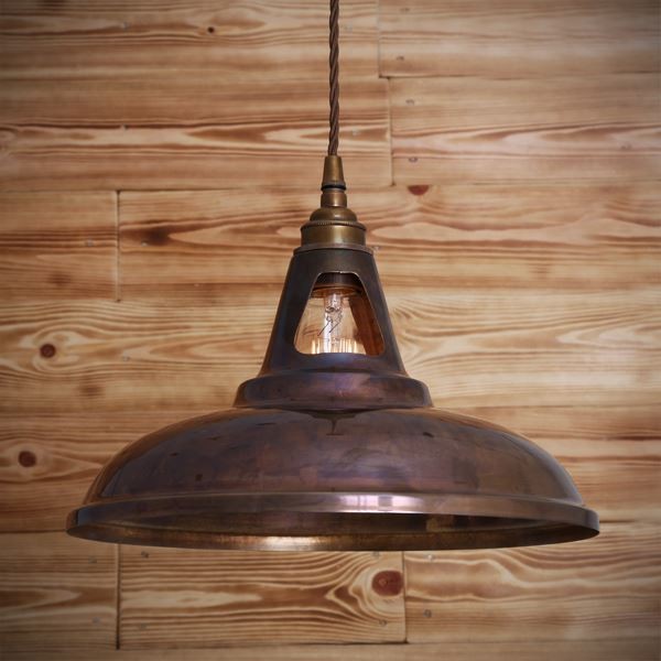With its subtly ornate design, the Geneva industrial brass pendant adds modern sophistication to any room. With elegance and versatility that work nicely in a variety of settings, this industrial pendant light will add style to your entryway or above a bar.