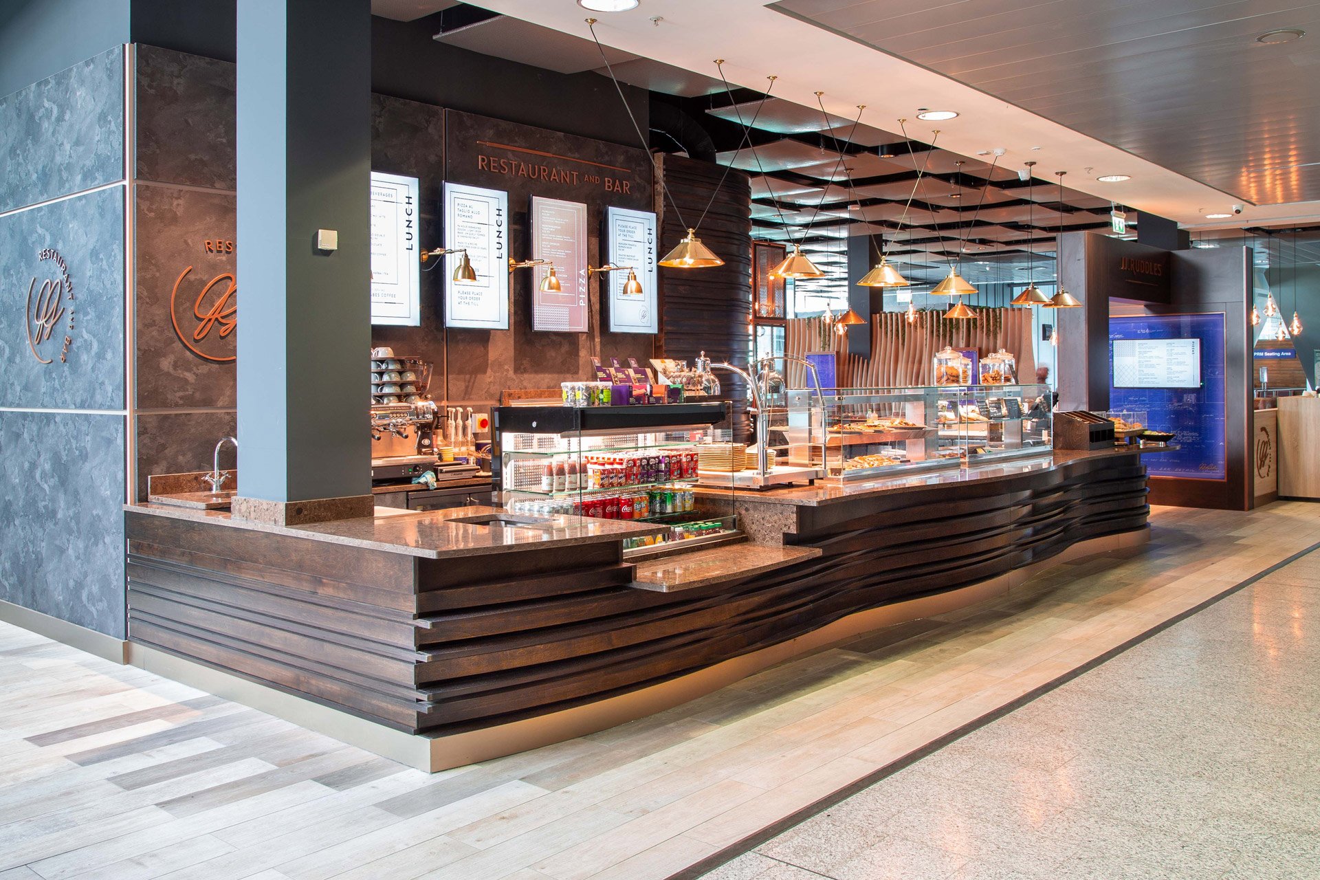 Vintage brass pendants enliven the character of JJ Ruddles, Shannon Airport