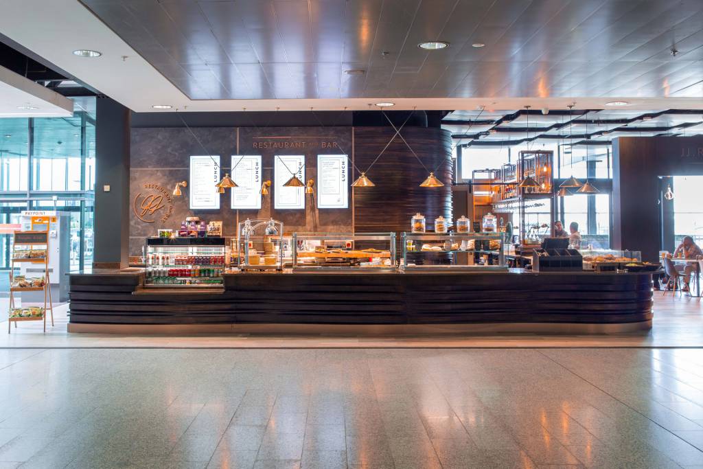 Our Nerissa pendants in antique brass create a welcoming glow at Shannon Airport 