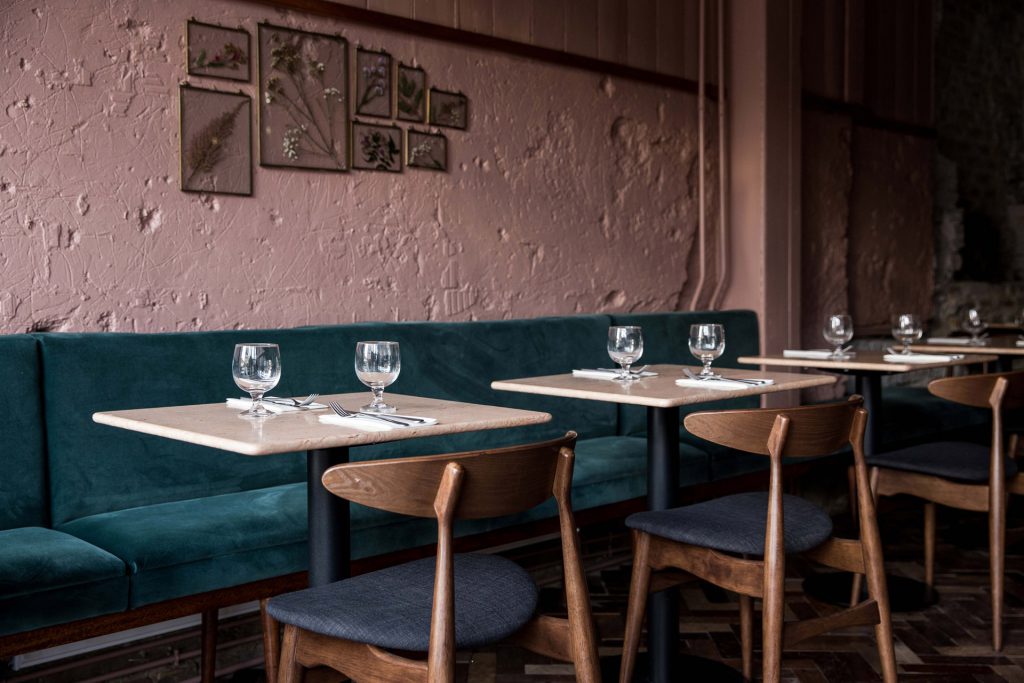 Italian rose limestone table tops at Kudu restaurant, London