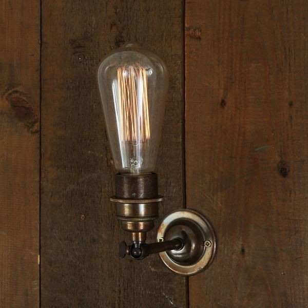 With a vintage touch, the Lome vintage double wall light creates a formal yet elegant atmosphere with a clean and simple profile. With two bare bulbs to enhance a decorative lighting, this vintage wall light is a valuable asset to brighten up the living room, hallway or reading area.