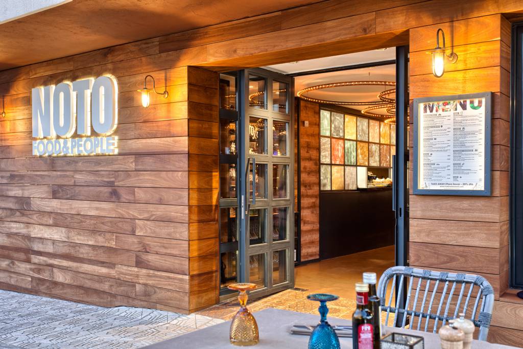 Our Fabo well glass wall lights illuminate the entrance of NOTO Restaurant