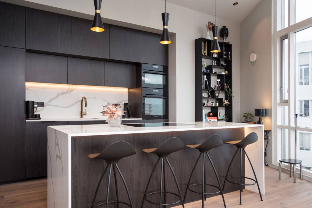 Our Cairo contemporary pendant lights delicately hang above this kitchen-island 