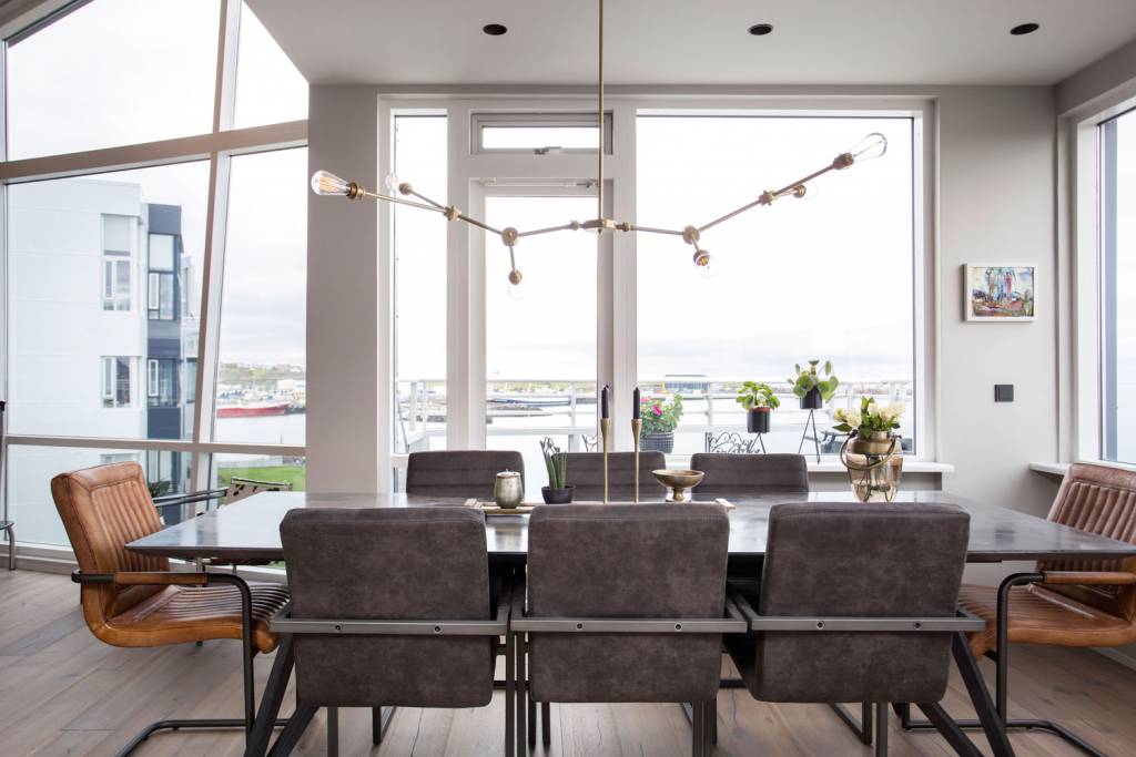 Our Ottawa chandelier creates a gentle spectrum of light across the dining area