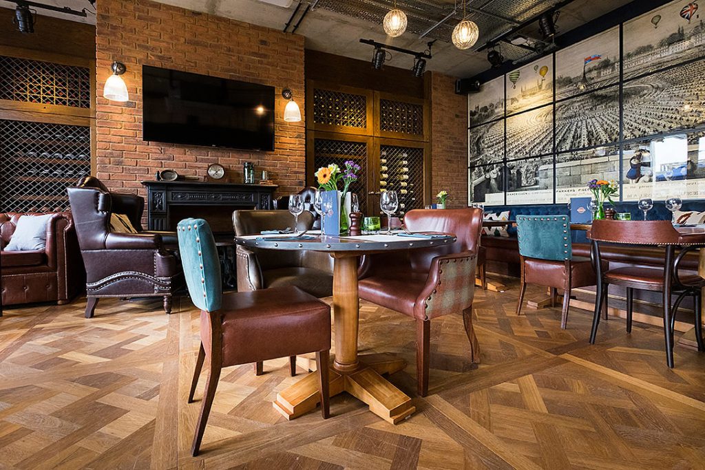 Our Fend wall lights used to accent the brick chimney breast of the Station Tavern, Cambridge