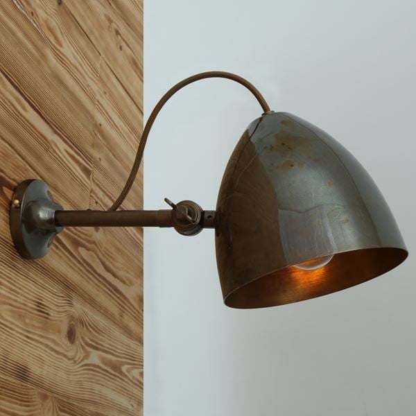 With a sophisticated design, the Quito cone wall light is a decorative way to add warm lighting to any room. This adjustable wall light looks great when used to lighting a staircase or as a single task light in the bedroom or study.