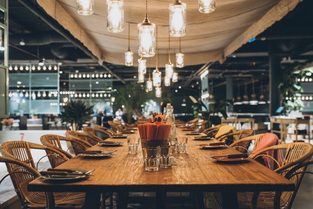 Jam Jar cluster pendants hang above a large oak dining table