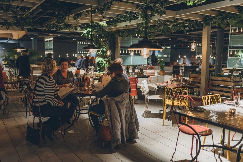 Industrial-style pendant lights used as part of this restaurant's lighting design