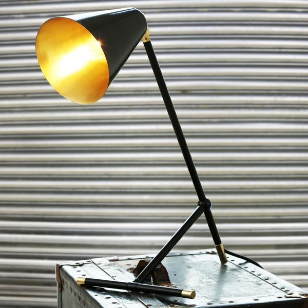 The Santa Clara modern table lamp is slim and handsomely designed with a industrial look that easily matches with modern and industrial interiors. The body of this desk lamp features traditional details that becomes a perfect addition to any den or office.