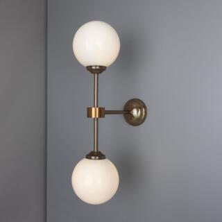 Yaounde Double Opal Glass Globe Brass Wall Sconce, Antique Brass
