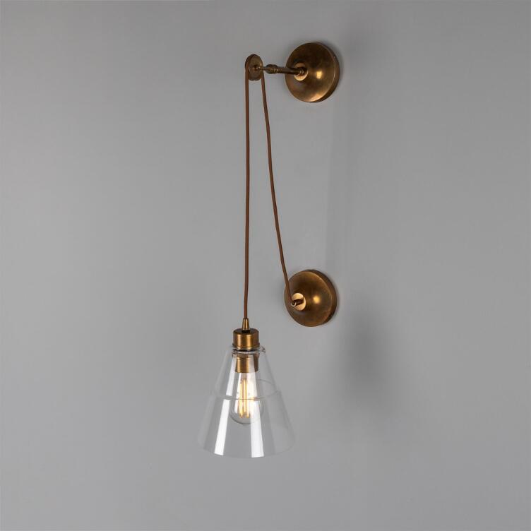 Rigale Industrial Pulley Wall Sconce with Stepped Glass Lamp Shade, Antique Brass Rigale Industrial Pulley Wall Sconce with Stepped Glass Lamp Shade, Antique Brass