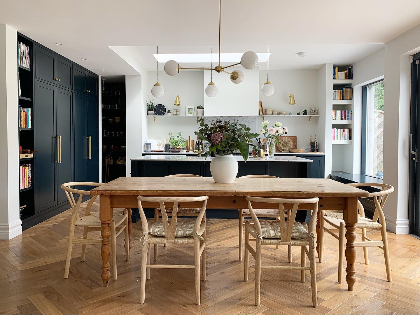 Layered lighting in charming kitchen