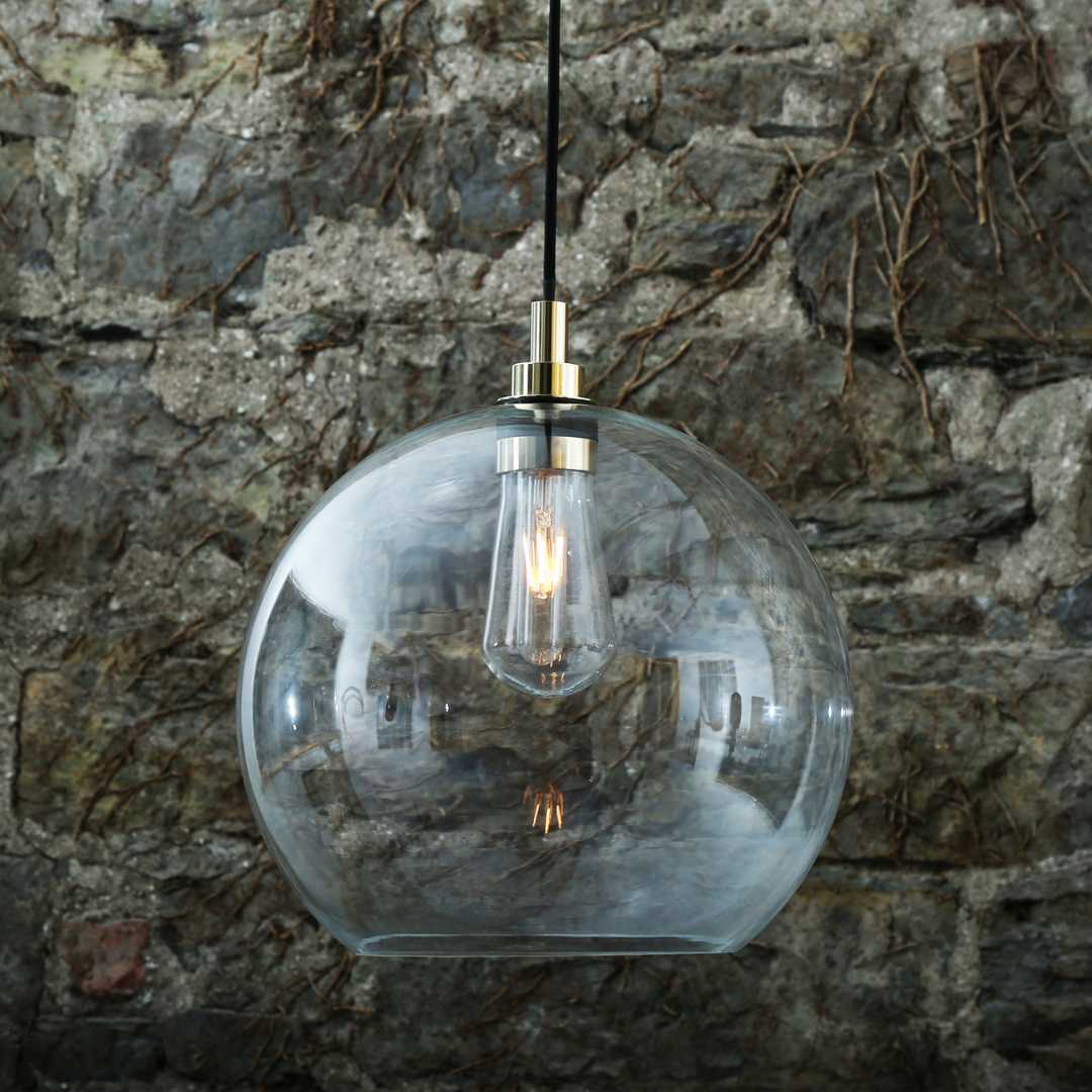 glass globe shade pendant light with raw bulb aesthetic