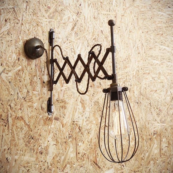 The Calis scissor arm light from Mullan Lighting uniquely extends from the wall whilst adding an industrial style to any space with a brass cage. 