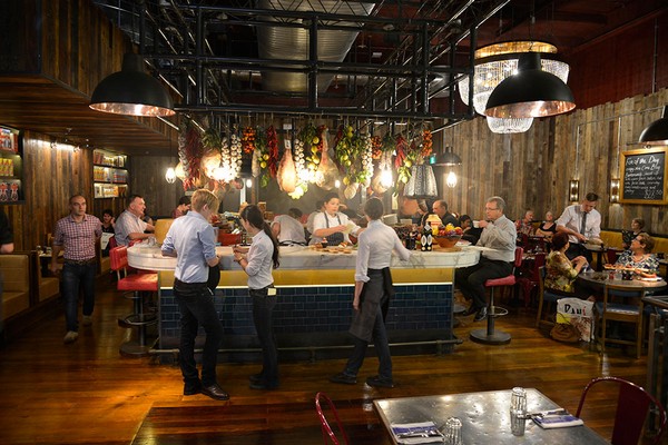 Jamie's Italian restaurant has an industrial-style decor that is accented by our industrial pendant lights. 