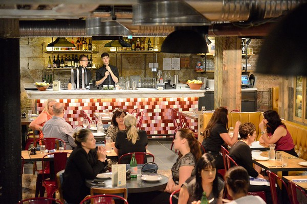 Our industrial pendant lights at Jamie's Italian Restaurant helps to create a homely atmosphere in the dining area 