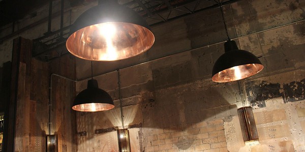 Industrial pendant lighting at Jamie's Italian restaurant helps to add to the unique atmosphere