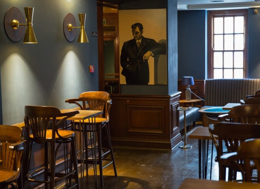 68 and Boston in Soho features Mullan Lighting's contemporary Cairo wall lights in a polished brass finish