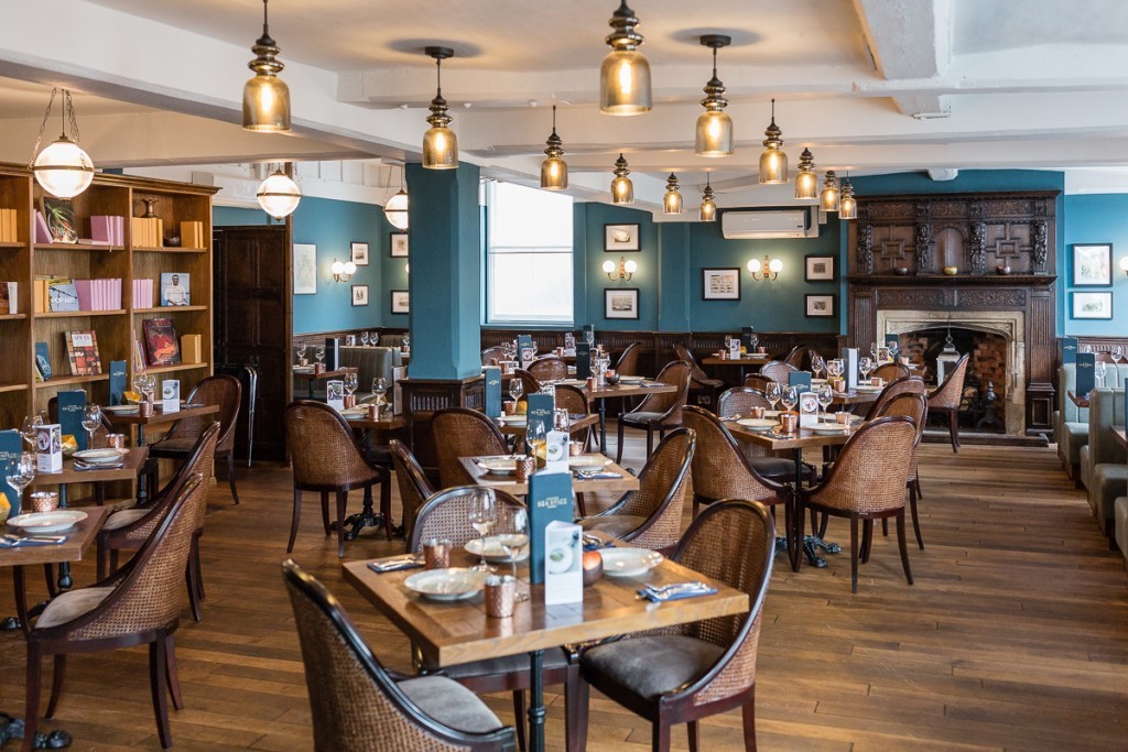 Decorative lighting fixtures from Mullan Lighting feature in this British coastal restaurant