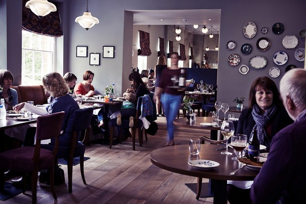 Essence pendant lights from Mullan Lighting are suspended in the dining space of The Church Street Tavern