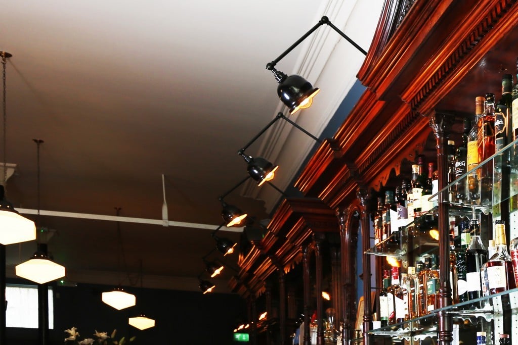 Traditional light fittings from Mullan Lighting complement the old-school wooden décor of Delahunt