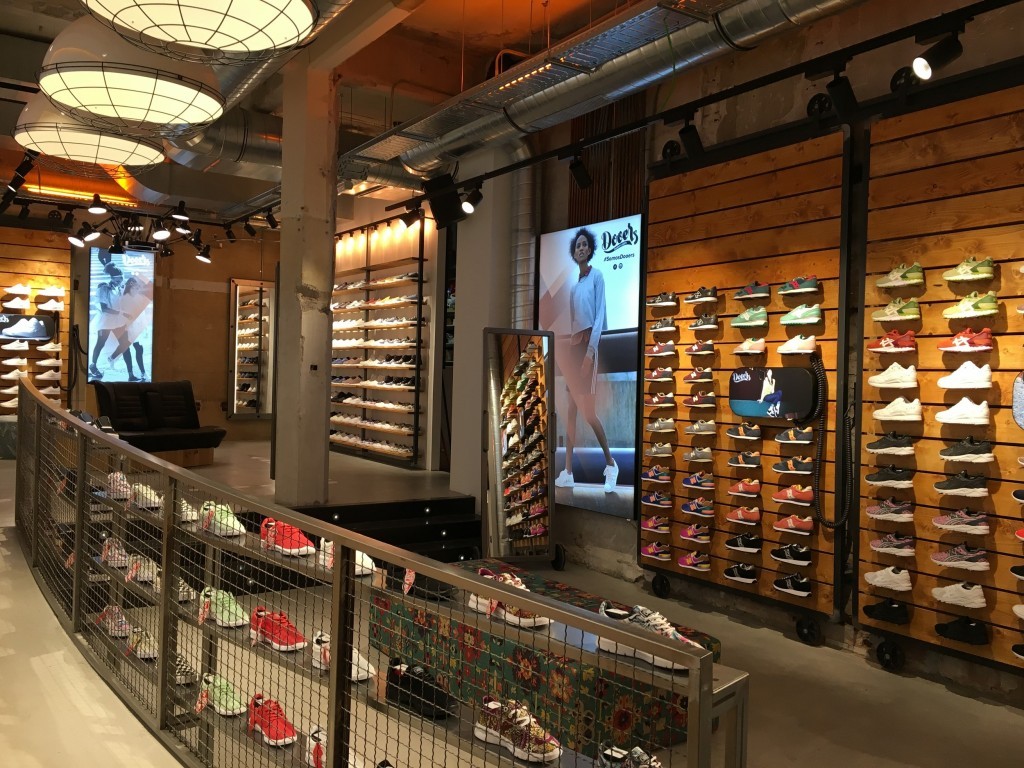 Brussels pendants from Mullan Lighting are suspended in this shoe store 