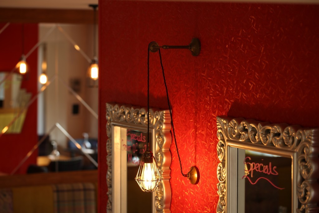 Our Apoch pulley cage wall light adds an industrial aesthetic to The Batch Loaf restaurant located in Co. Monaghan. 