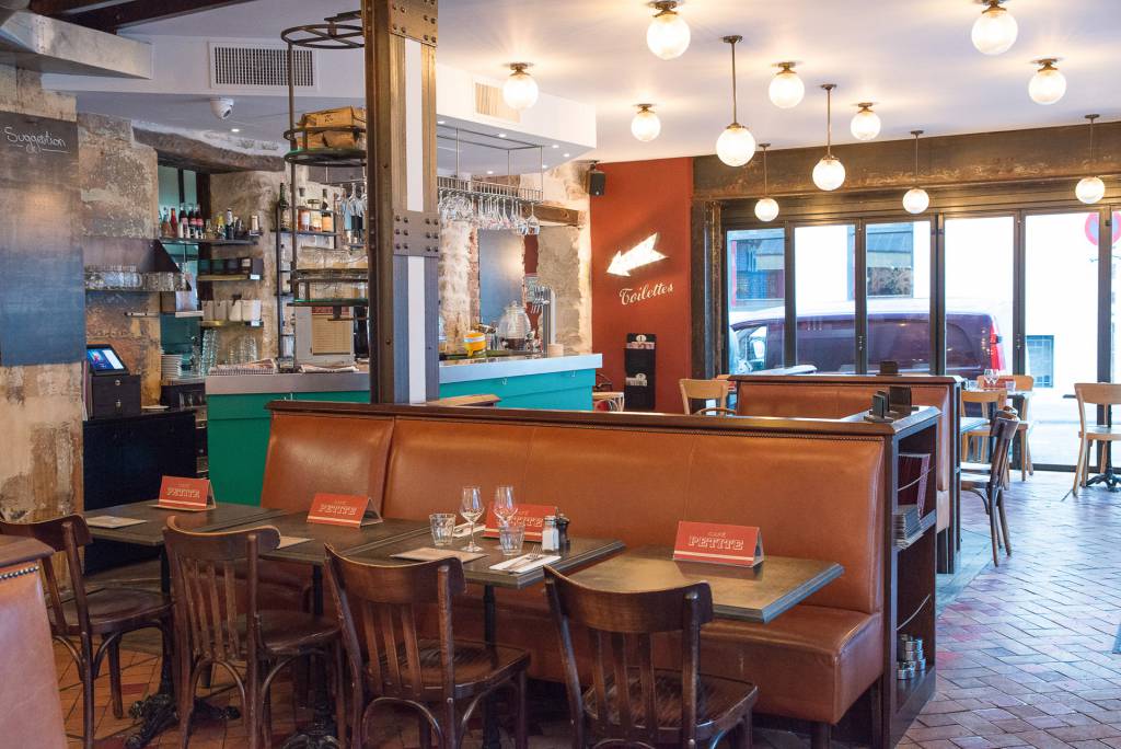 Our Stanley holophane globe ceiling lights and pendants at Café Petite.