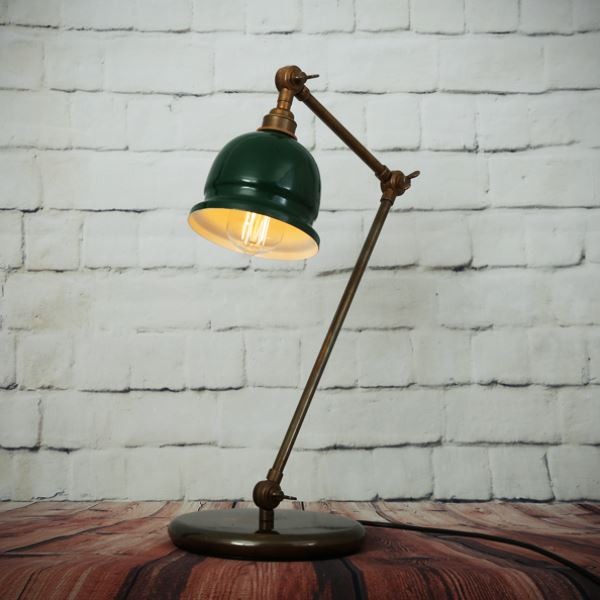 The Nico table lamp offers an eye-catching profile and appearance. Designed for use on a masculine style desk or an antique end table, this industrial desk lamp could also serve as an accent in an artist's studio or illuminate a modern loft space.