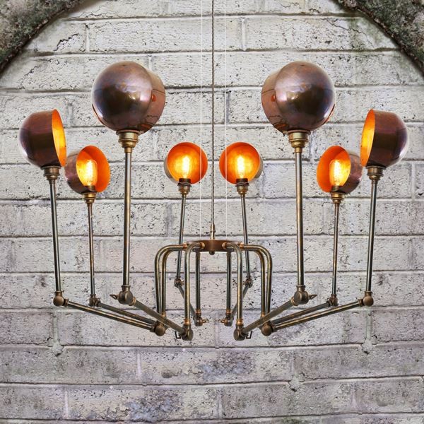 Inspired by 1940's industrialism, the San Jose modern chandelier embodies charm and style to any room. With eight adjustable arms and shades extending from a central column, this modern chandelier has a bold, sculptural presence.